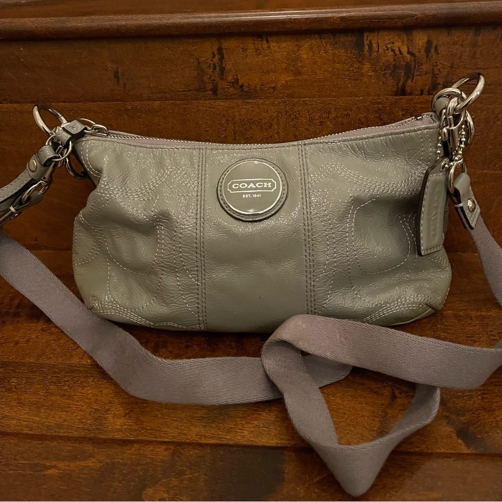 Patent dove gray color crossbody purse by Coach